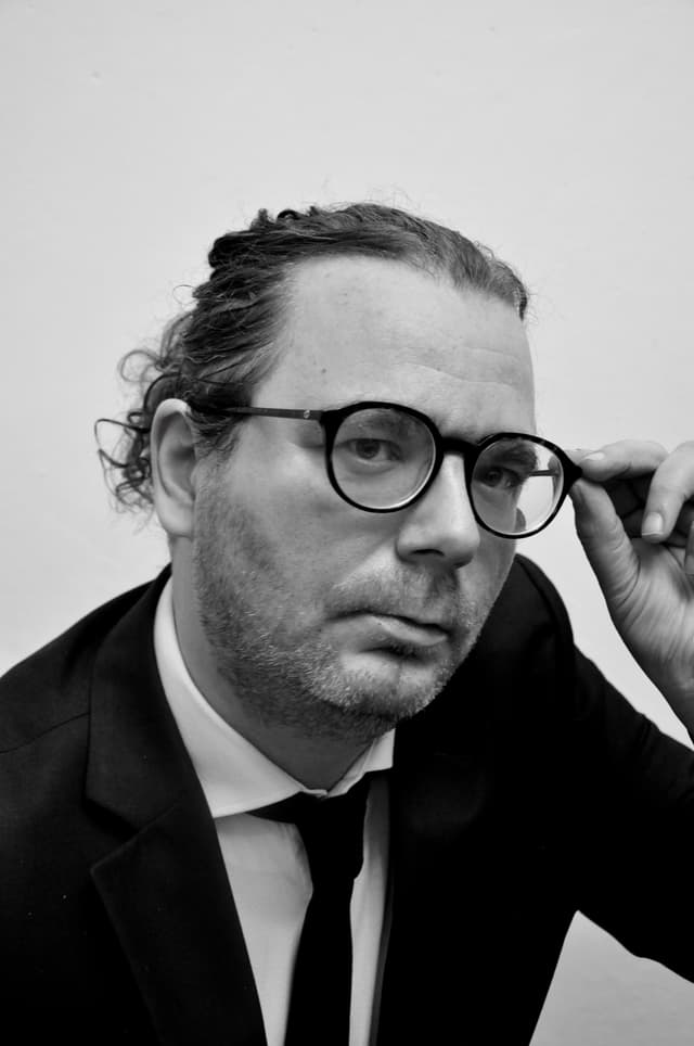 Man in business suit with glasses